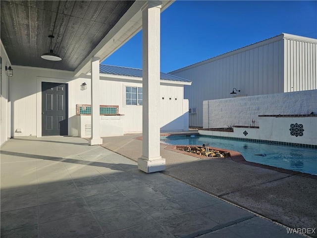 view of patio with an outdoor pool