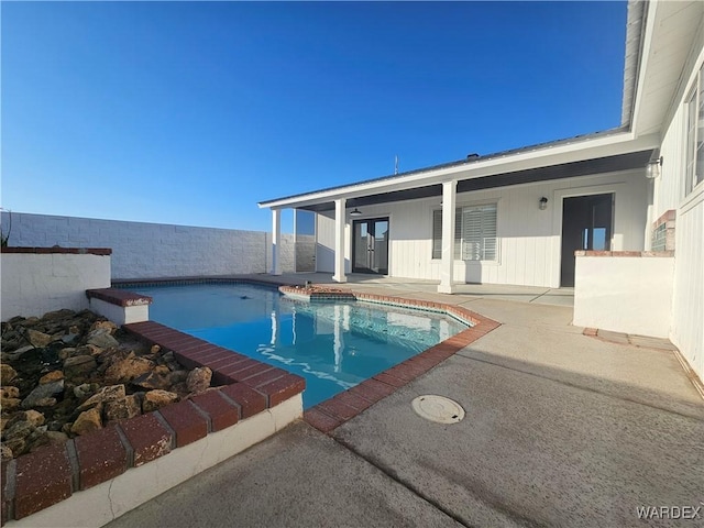 view of pool featuring a fenced in pool and a patio area