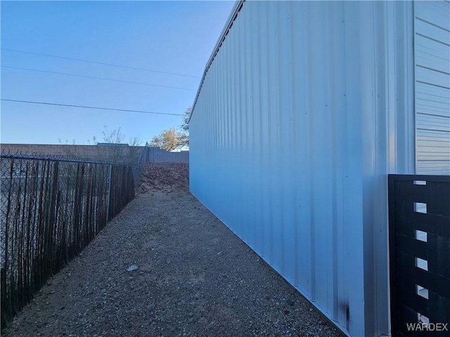 view of side of home featuring a fenced backyard