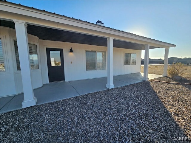 doorway to property featuring a patio area