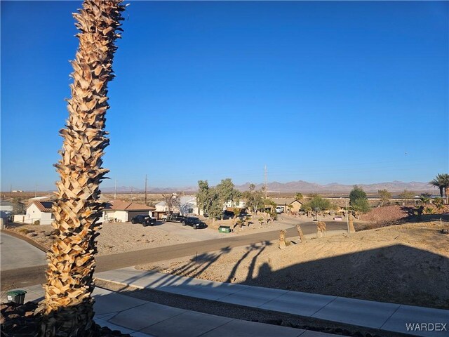 view of street featuring a residential view and a mountain view