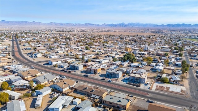 drone / aerial view featuring a residential view and a mountain view