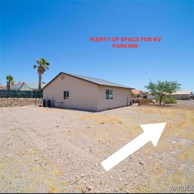 view of side of property with stucco siding