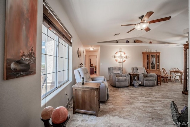 sitting room featuring a ceiling fan, lofted ceiling, a healthy amount of sunlight, and visible vents