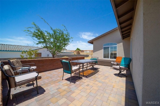 view of patio / terrace with outdoor dining area and a fenced backyard