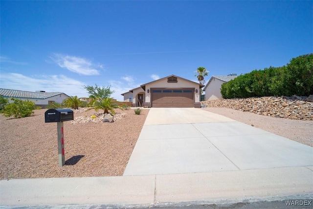 ranch-style house with driveway, an attached garage, and stucco siding