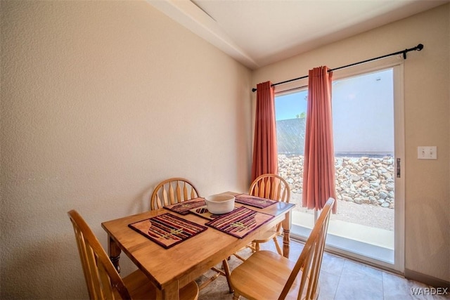 dining area featuring baseboards