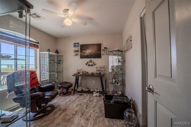 misc room featuring visible vents and ceiling fan