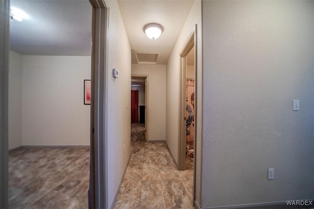 hallway featuring attic access