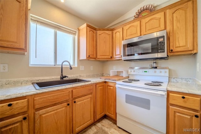 kitchen with white electric range, stainless steel microwave, and a sink