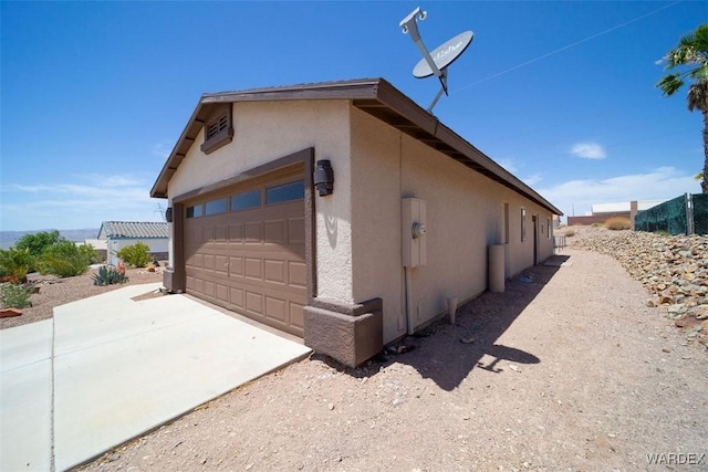 view of side of property with stucco siding