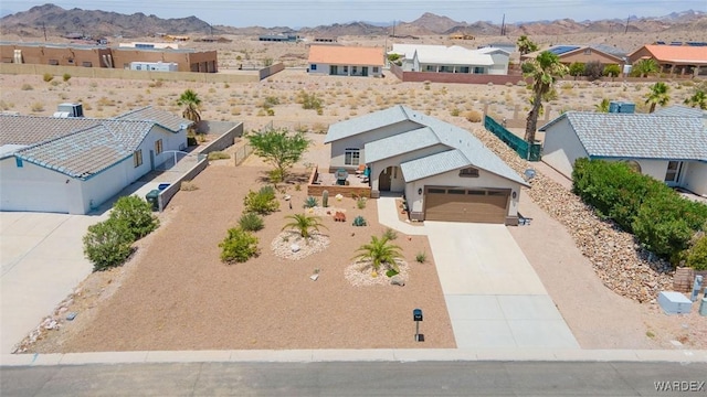 birds eye view of property featuring a residential view and a mountain view