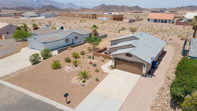 birds eye view of property featuring a mountain view