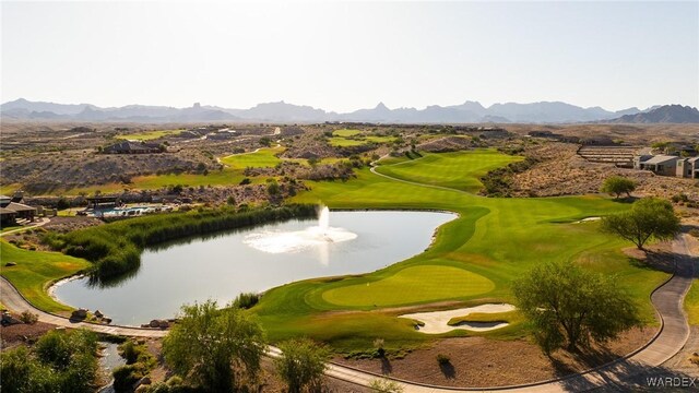 view of property's community featuring view of golf course and a water and mountain view