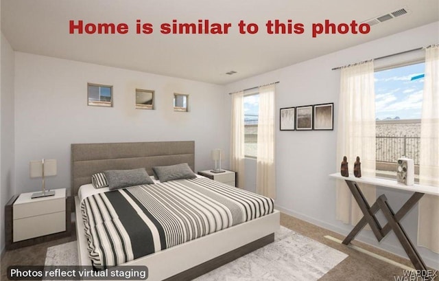 bedroom with carpet floors, visible vents, and baseboards