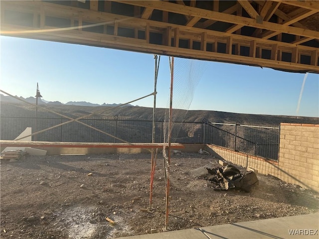 view of yard featuring a fenced backyard and a mountain view