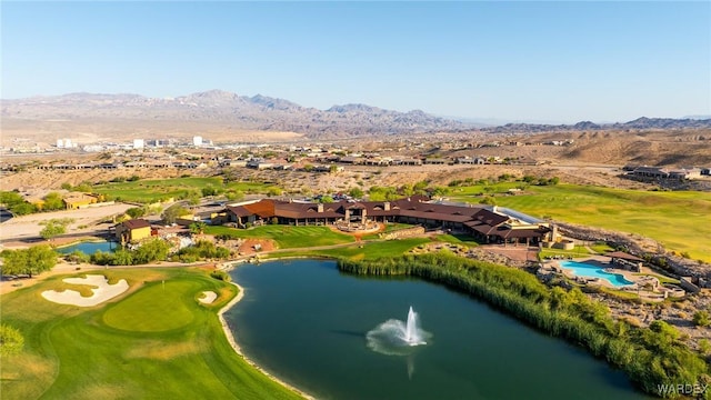 bird's eye view featuring view of golf course and a water and mountain view