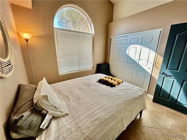 bedroom featuring light tile patterned floors