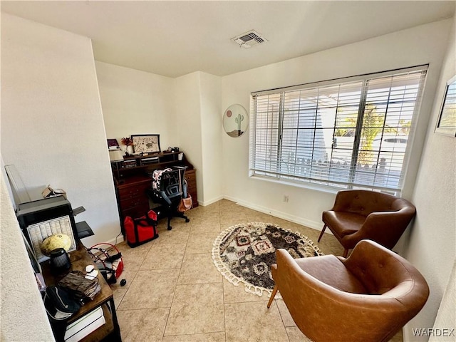 home office featuring visible vents, baseboards, and light tile patterned flooring