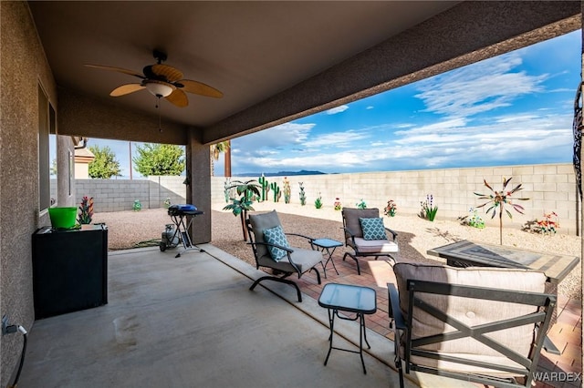 view of patio / terrace featuring a fenced backyard and a ceiling fan