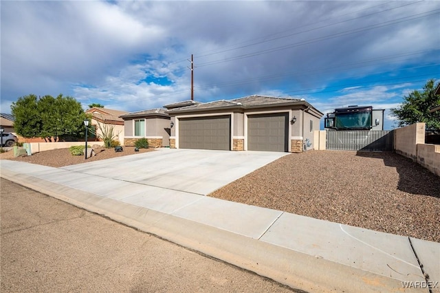 view of front facade with solar panels, concrete driveway, an attached garage, and stucco siding