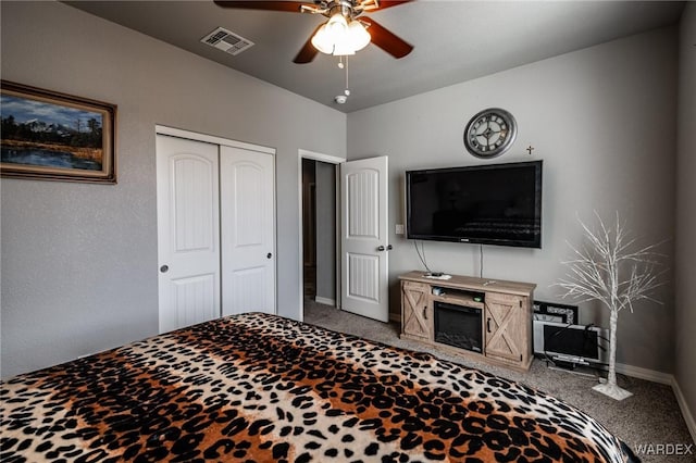 bedroom with light carpet, baseboards, visible vents, ceiling fan, and a closet