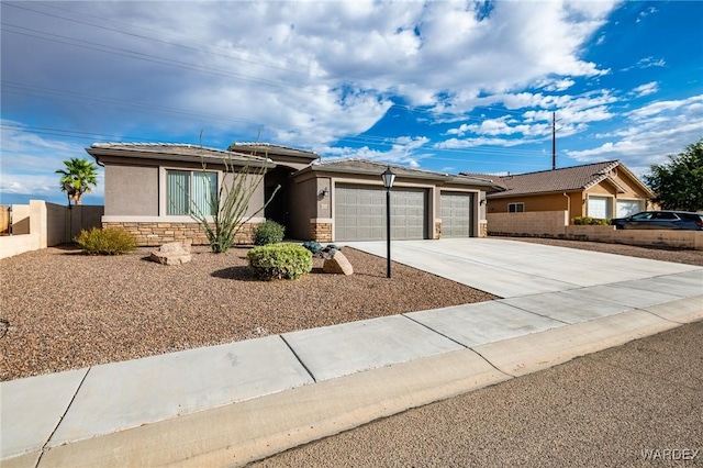 ranch-style house featuring a garage, stone siding, driveway, and stucco siding