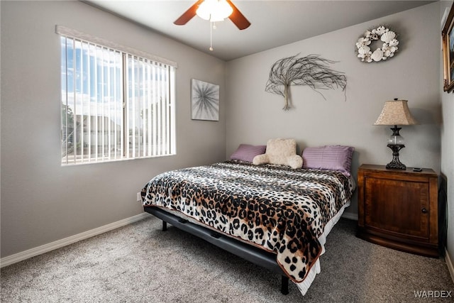 carpeted bedroom featuring ceiling fan and baseboards