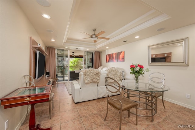 living area with recessed lighting, a raised ceiling, a ceiling fan, and crown molding