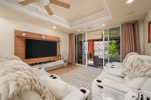 living area with visible vents, crown molding, recessed lighting, a raised ceiling, and a ceiling fan