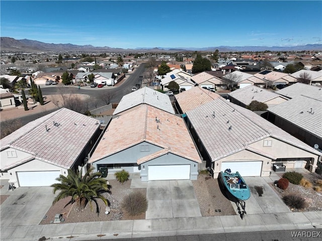 birds eye view of property featuring a residential view and a mountain view