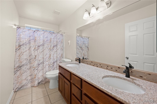 full bathroom featuring visible vents, a sink, toilet, and tile patterned floors