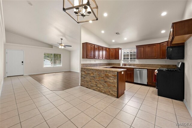 kitchen featuring dishwasher, open floor plan, light tile patterned flooring, and range with gas stovetop