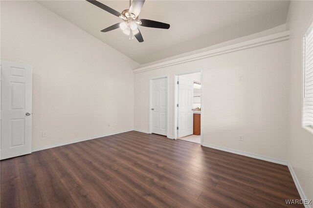 unfurnished bedroom featuring vaulted ceiling, ceiling fan, wood finished floors, and baseboards