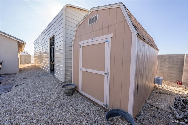 view of shed featuring a fenced backyard