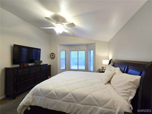 bedroom featuring vaulted ceiling, carpet floors, and ceiling fan