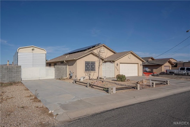 single story home with a garage, fence, stucco siding, a gate, and driveway