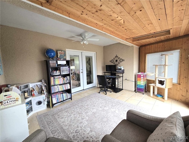 interior space featuring tile patterned floors, french doors, wooden ceiling, and a ceiling fan