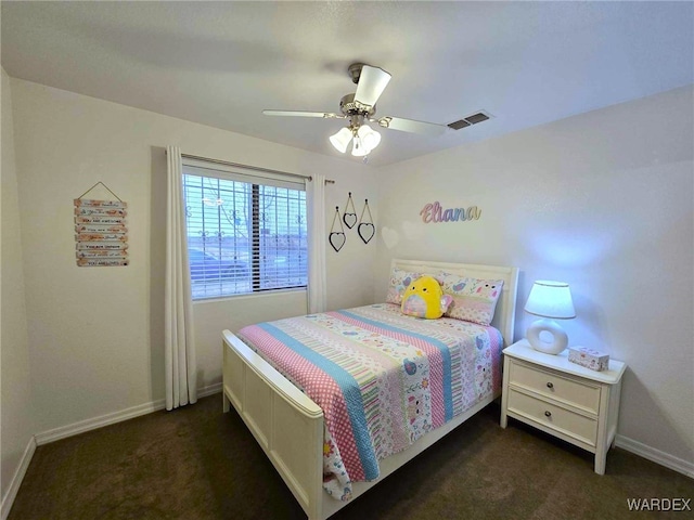 carpeted bedroom with a ceiling fan, baseboards, and visible vents