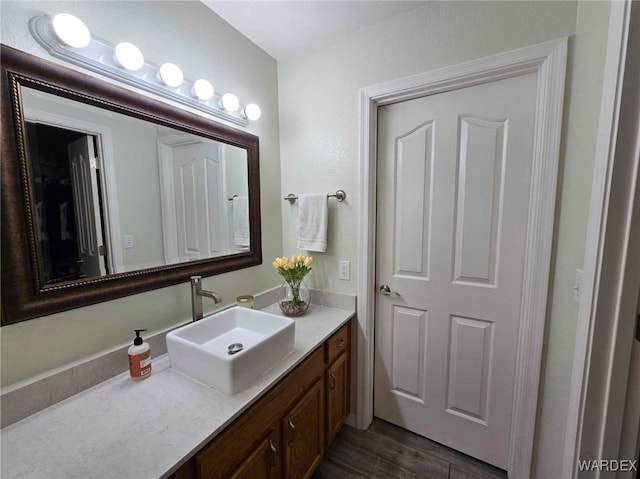 bathroom featuring vanity and wood finished floors