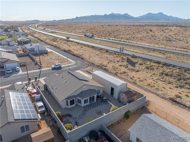 aerial view featuring a mountain view and view of desert