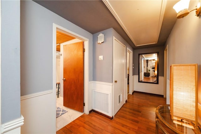 corridor featuring wood finished floors
