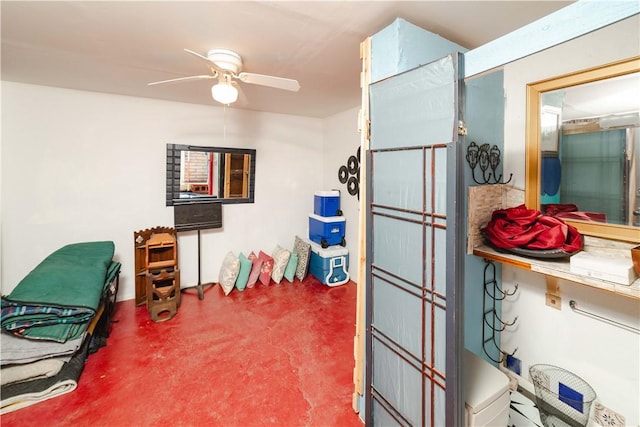 bathroom with concrete floors and a ceiling fan