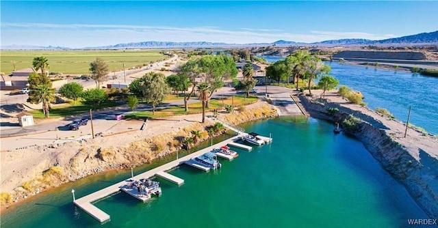 bird's eye view with a water and mountain view