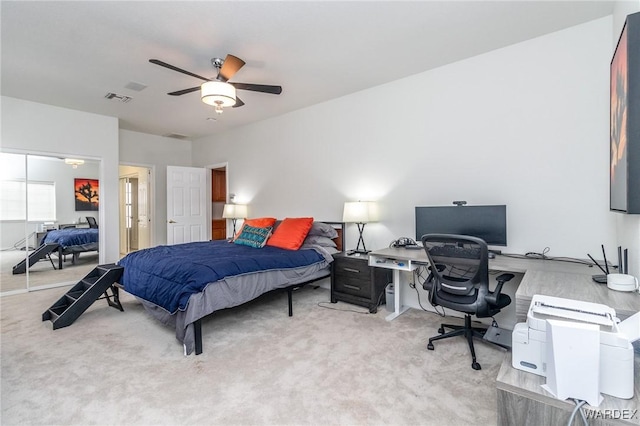 bedroom featuring visible vents, carpet floors, and a ceiling fan