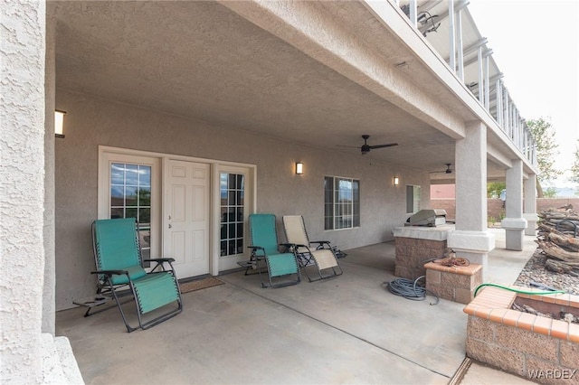 view of patio featuring area for grilling, grilling area, and ceiling fan