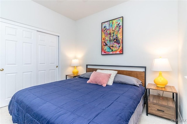 carpeted bedroom featuring a closet