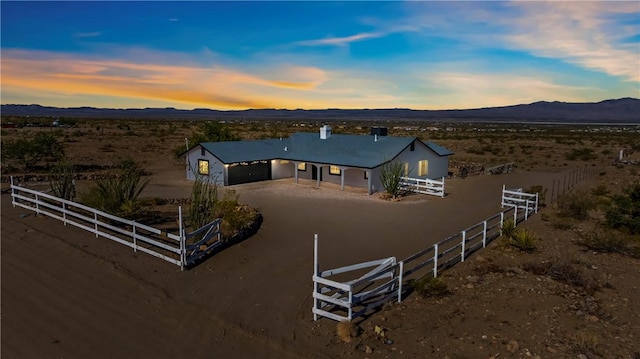 15565 Iron Dr, Dolan Springs, AZ 86441 - aerial view at dusk of a mountain view and a view of rural / pastoral area