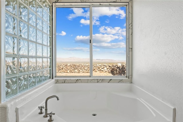 15565 Iron Dr, Dolan Springs, AZ 86441 - full bathroom with a textured wall and a garden tub