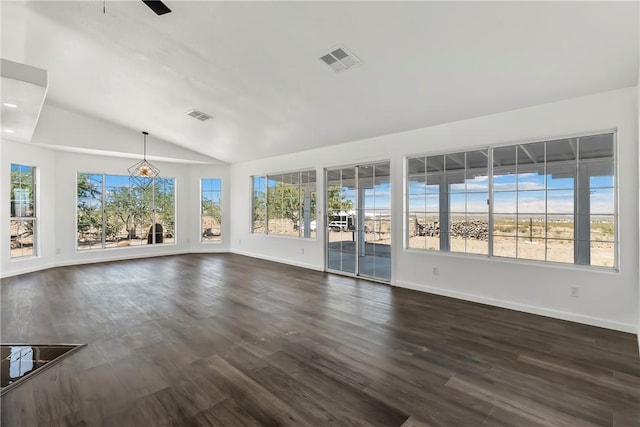 15565 Iron Dr, Dolan Springs, AZ 86441 - unfurnished living room featuring vaulted ceiling and dark wood-style flooring